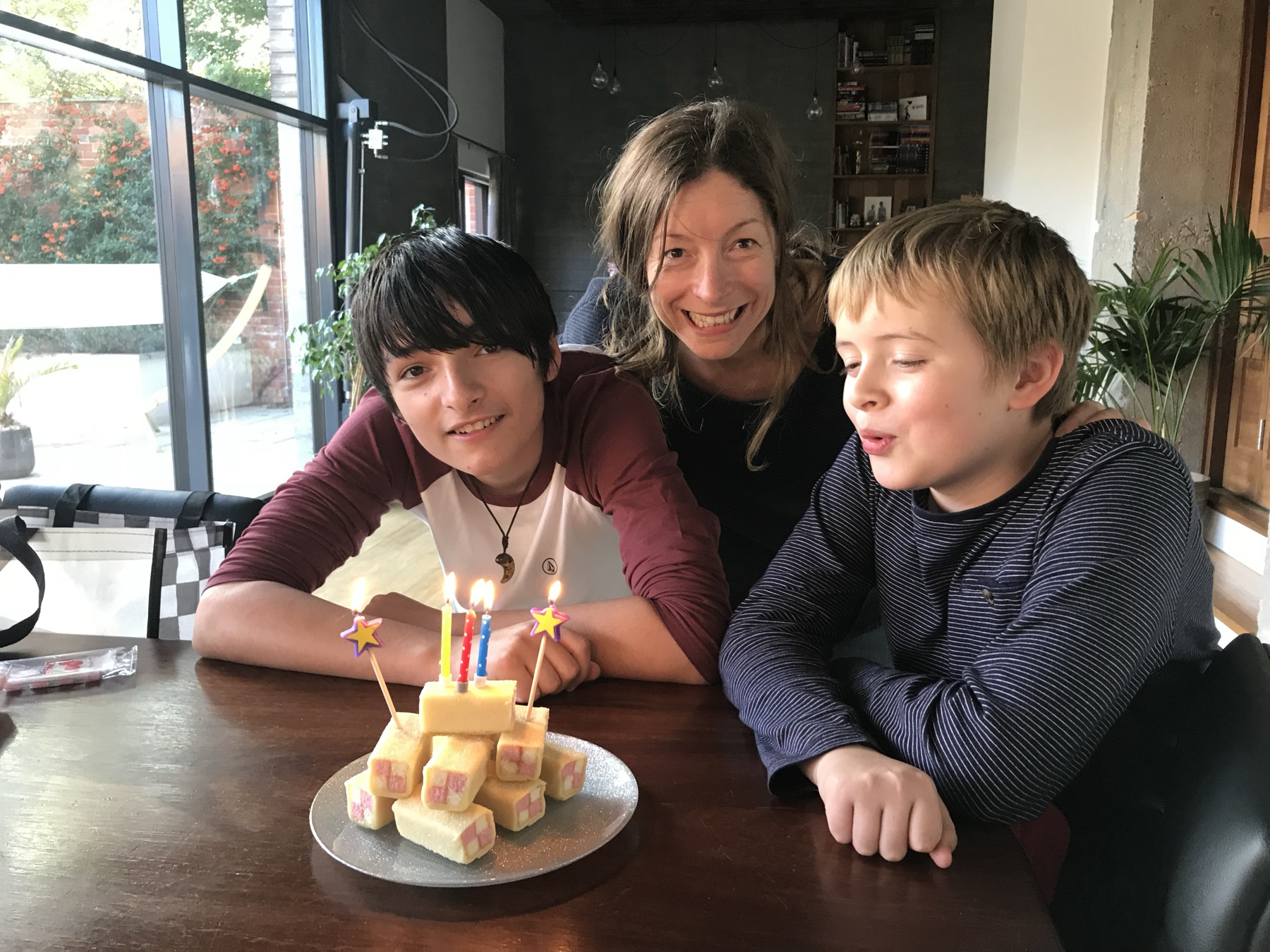 Kate, Jac and Dylan with a Battenberg birthday cake