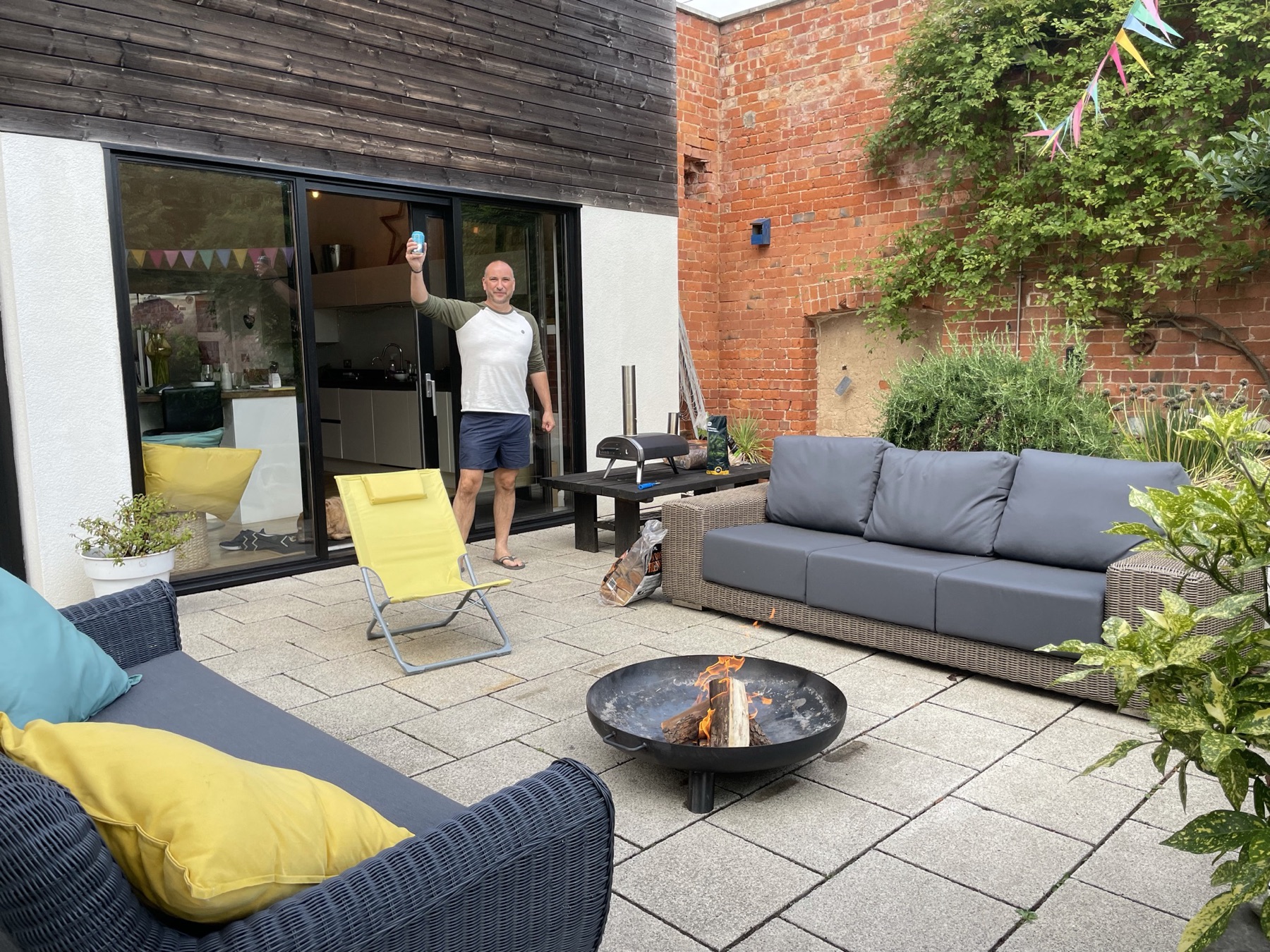 A toast on the patio, pizza oven going