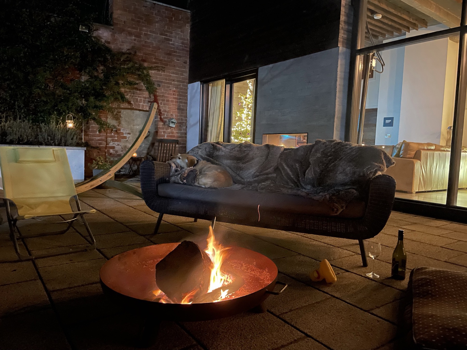 The fire pit at Christmas, the dog asleep on the sofa