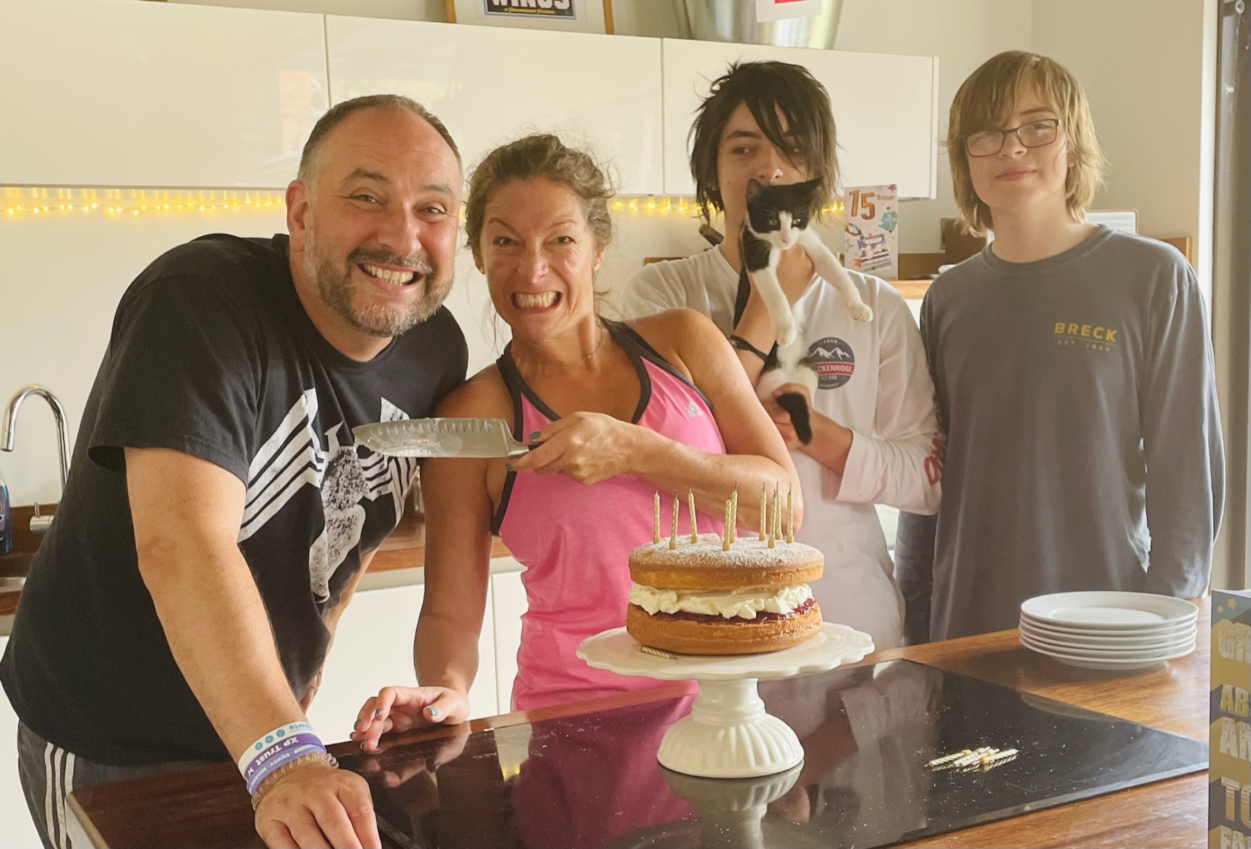 A birthday in the kitchen — cake, the cat, the lot