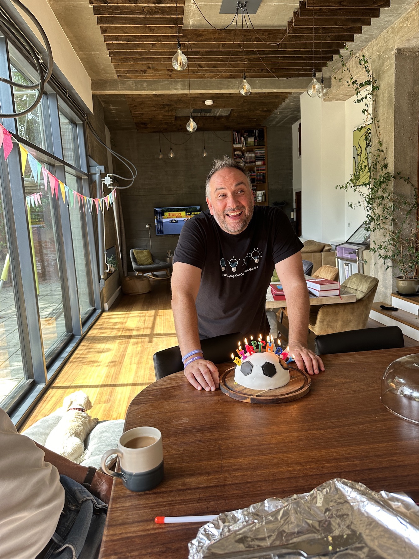Blowing out candles on a football cake