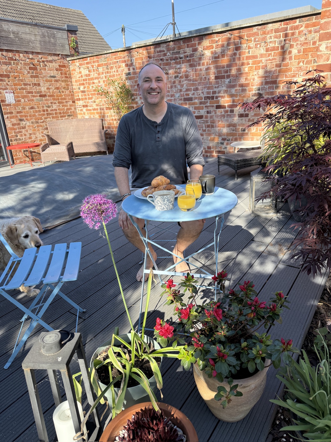 Breakfast on the deck in the sun, croissants and the dog