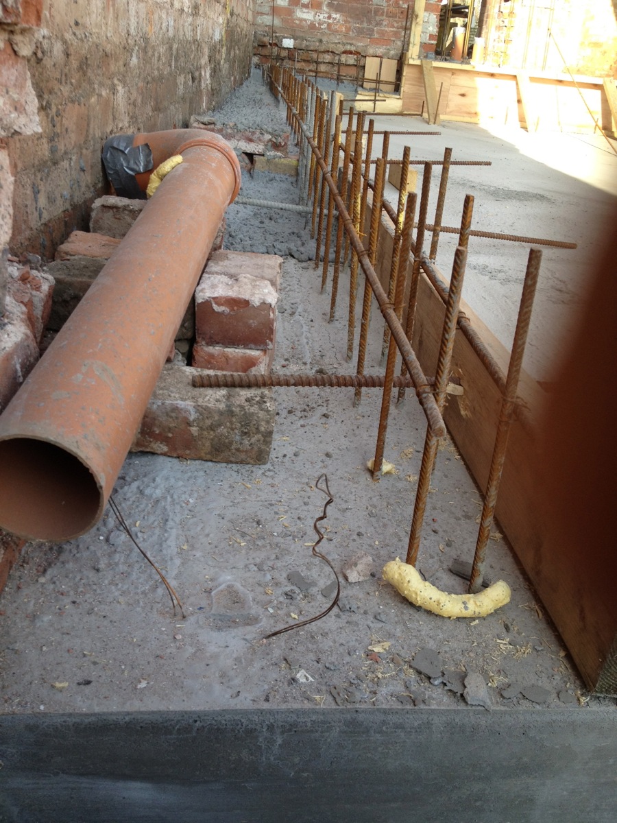 The board marked concrete wall and fireplace