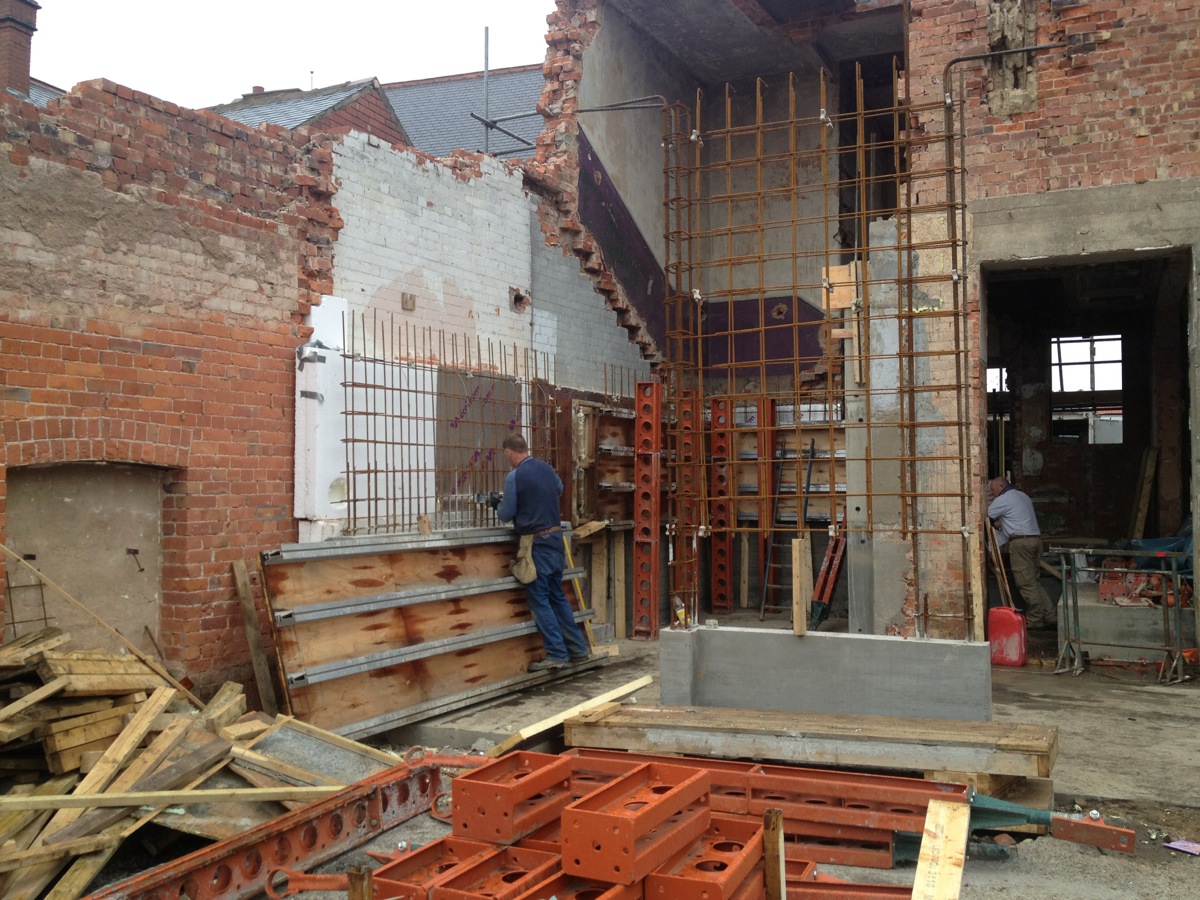 The board marked concrete wall and fireplace