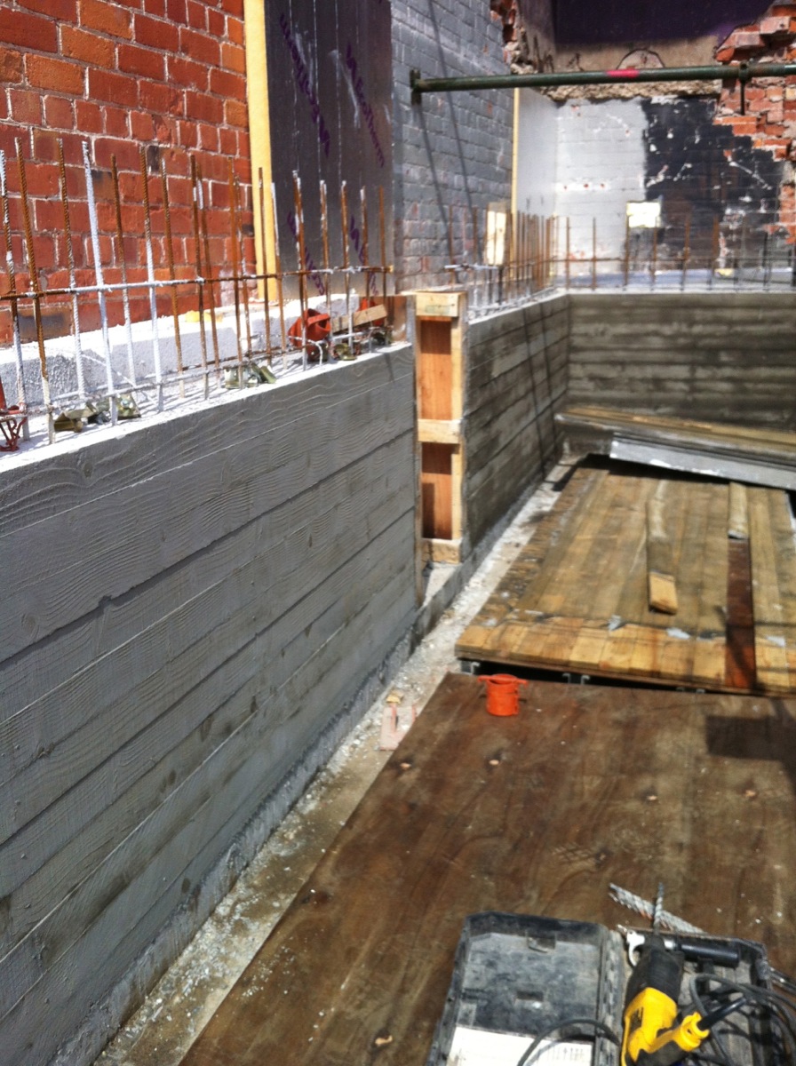 The board marked concrete wall and fireplace