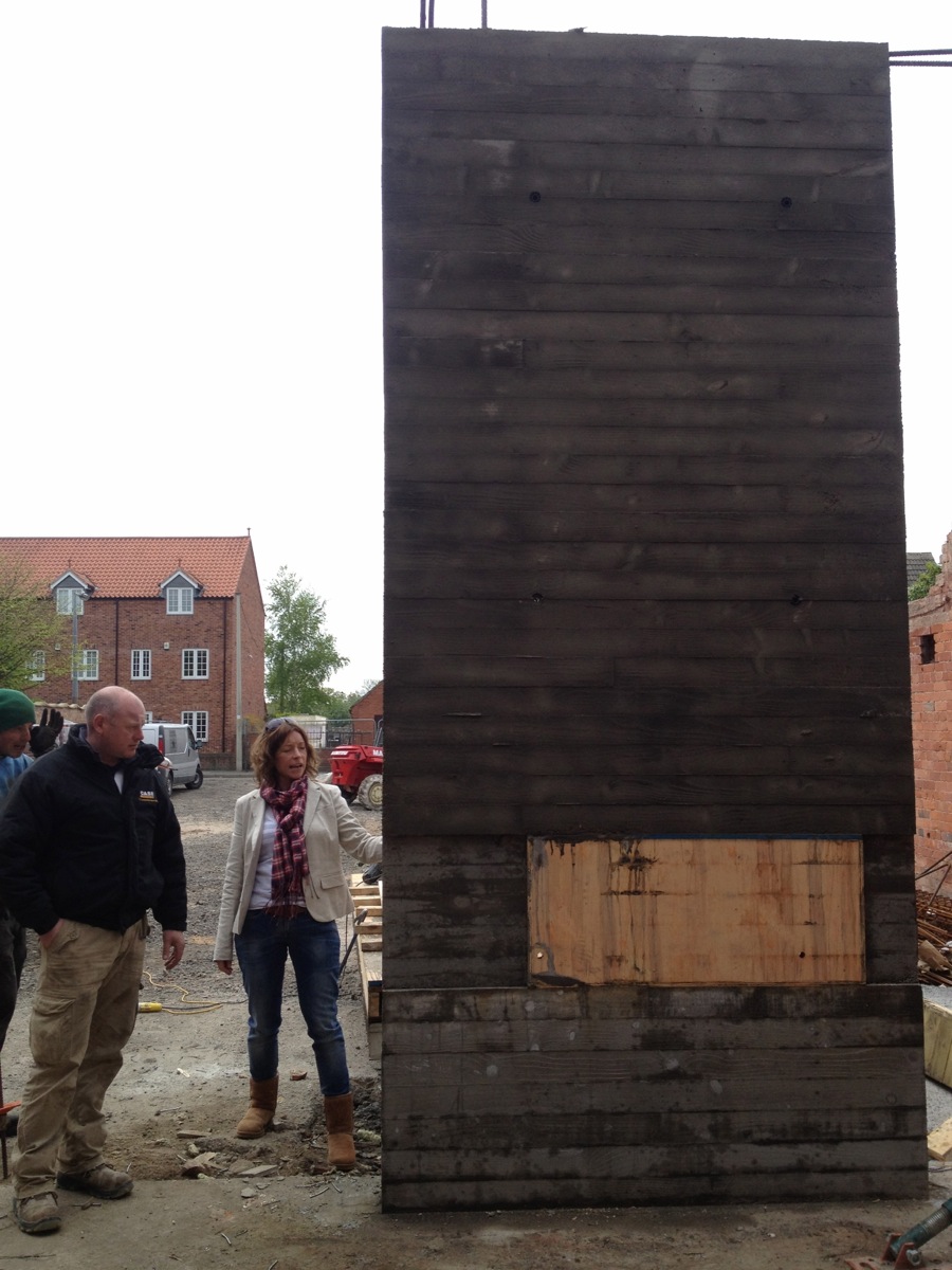 The board marked concrete wall and fireplace