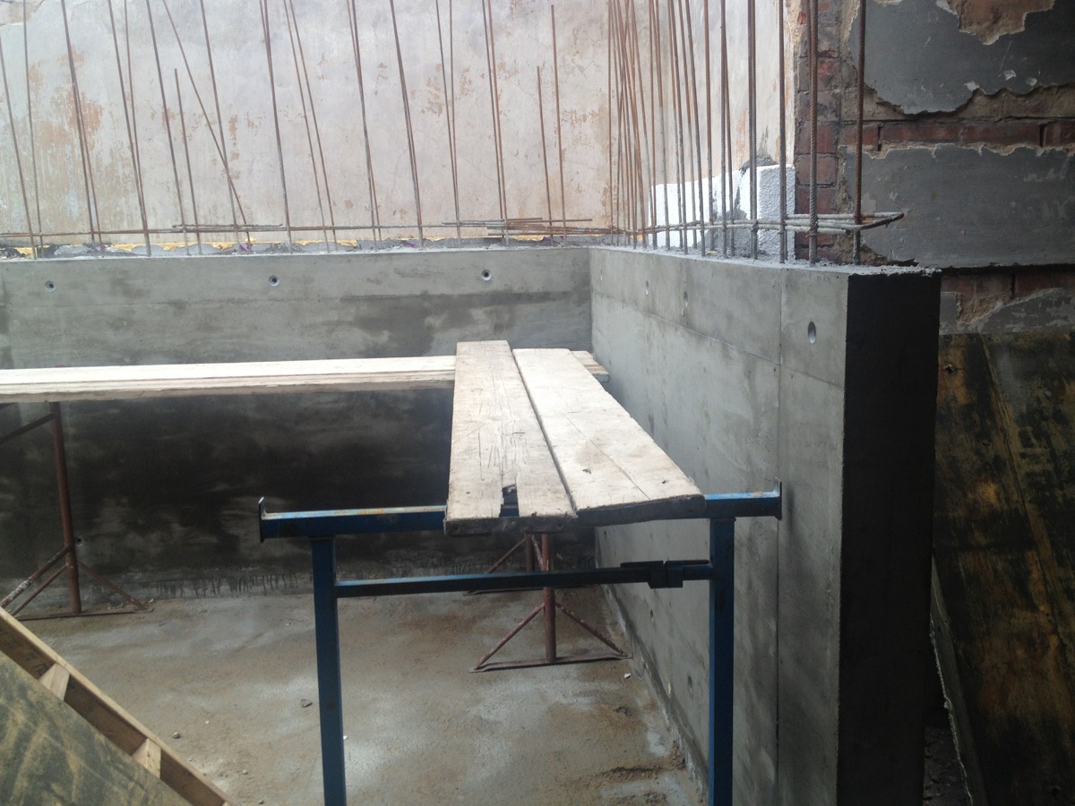 The bedroom and en suite wall and fireplace